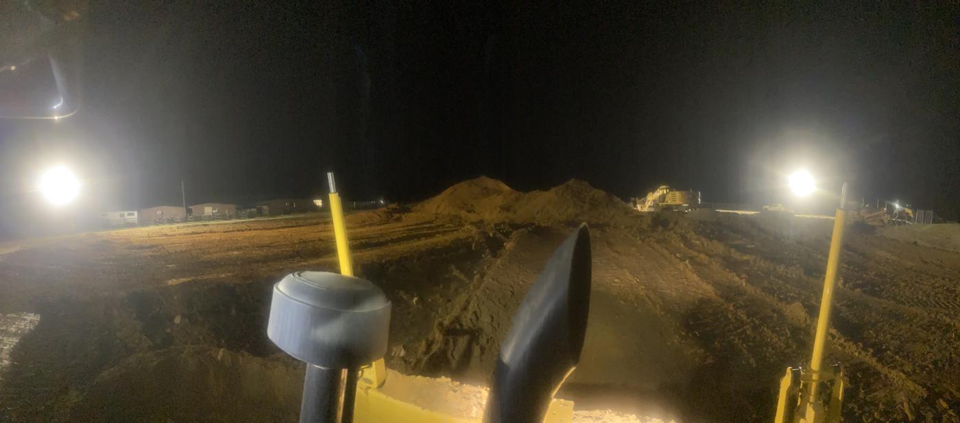 Laser grading at night from the operator's seat